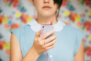 Trendy hipster using smart phone